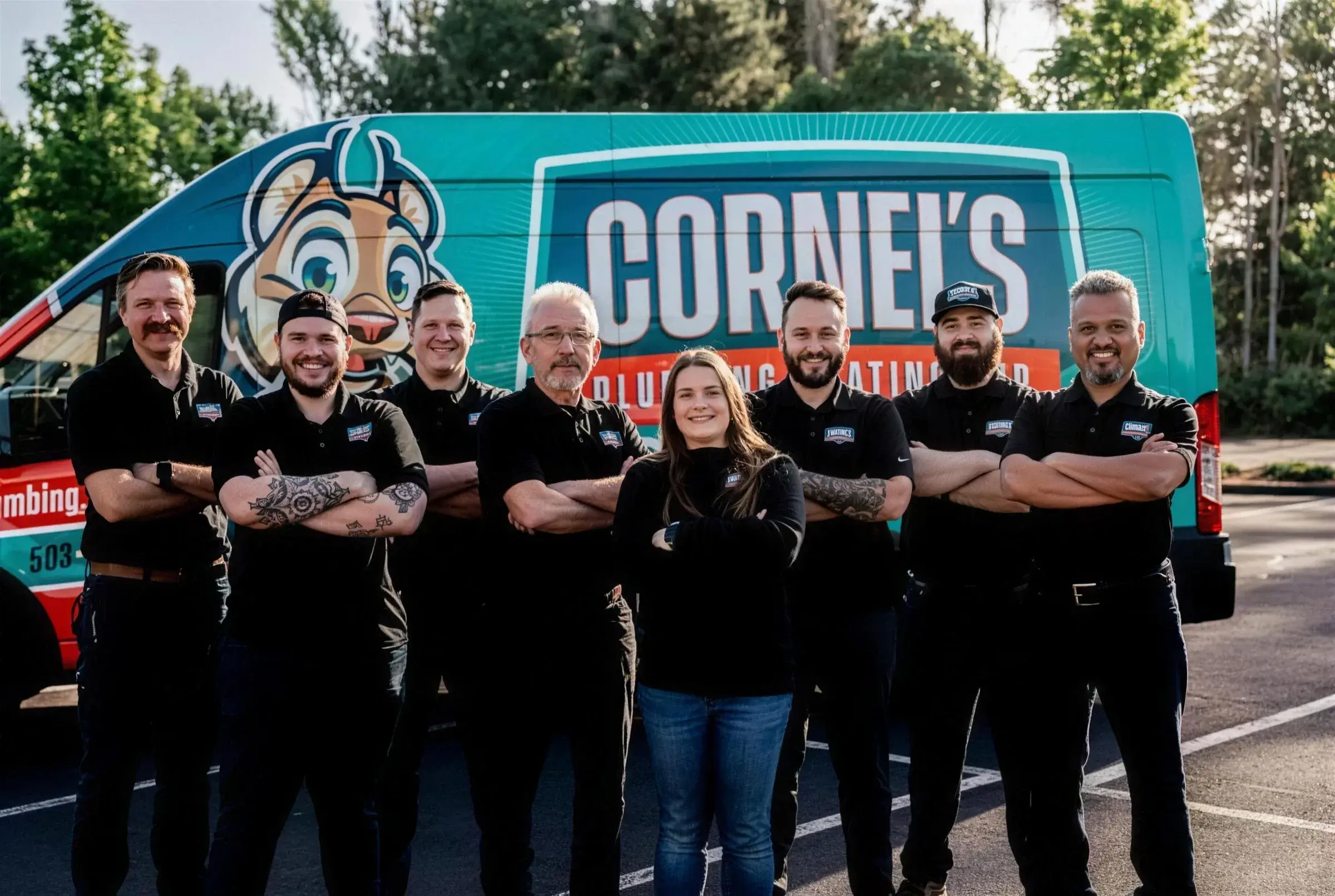 The Cornel's Plumbing team standing in front of a company van