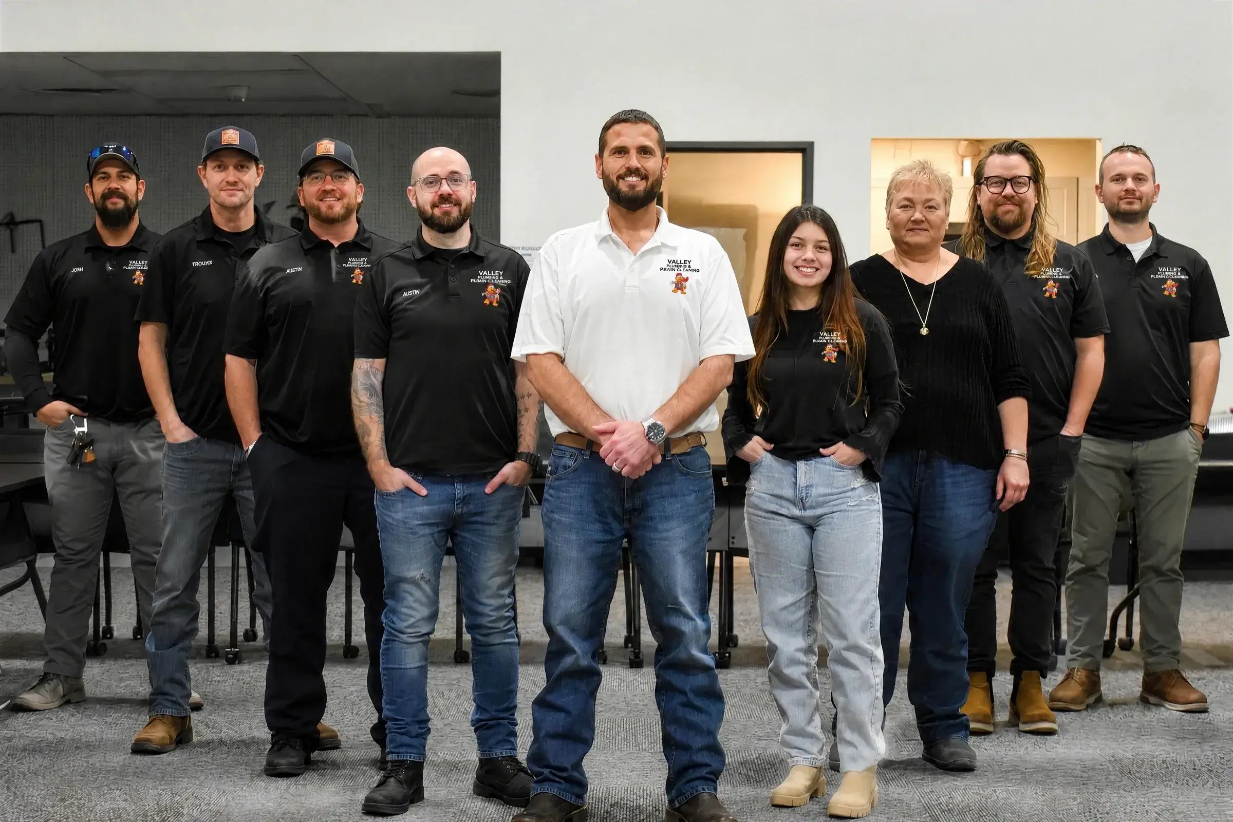 The Valley Plumbing, Heating & Cooling team standing together in their shop